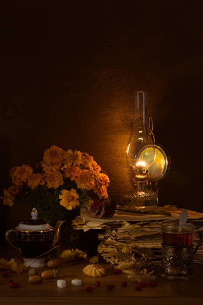 istock Still life with a kerosene lamp, tea in a glass 1083252538