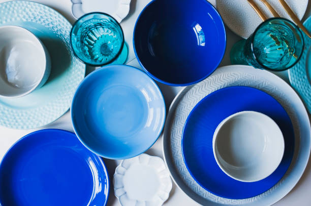 istock set of dishware in blue tones. Ceramic plates and wine glasses top view 1083253204
