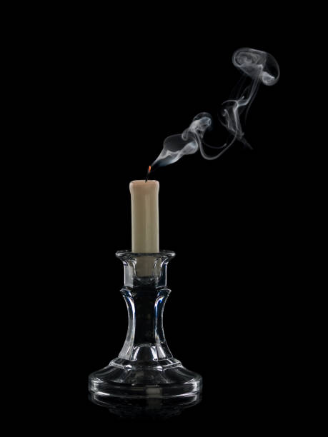 istock The extinguished candle in a glass candlestick 1083255598