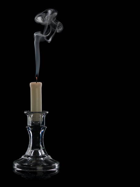 istock The extinguished candle in a glass candlestick 1083255602