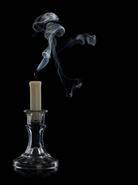 istock The extinguished candle in a glass candlestick 1083255604