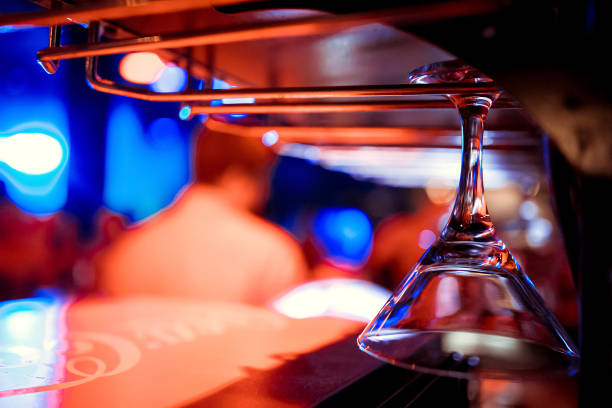 istock Glasses hanging over a bar rack 1083259674