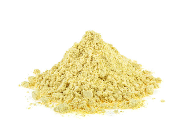 istock Heap of ginger powder isolated on white background 1083259826