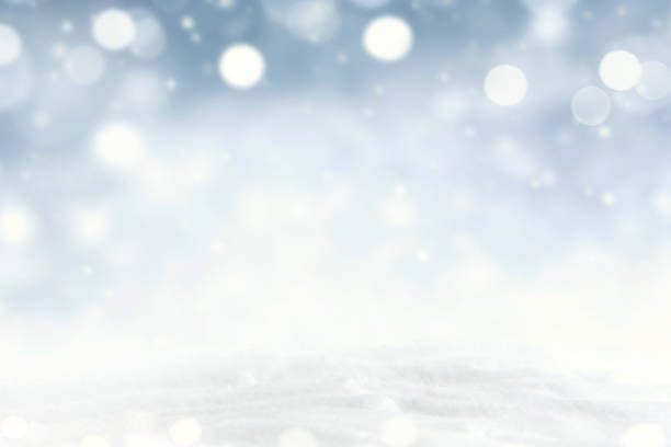 istock Snowflakes and snowfall on a cold blue winter background. 1083261840