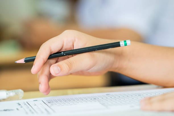 istock Education art practice concept : Hands high school, university student holding pencil for testing drawing and writing paper sheet and exercise in art classroom 1083270648