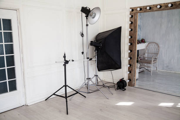 istock Interior of PhotoStudio flashes white grey background decor 1083272420