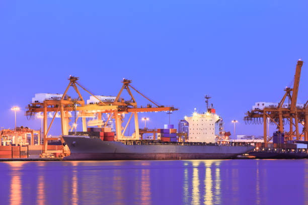 istock Container cargo freight ship at port twilight 1083275858