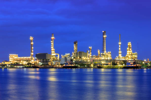 istock Oil refinery at twilight with reflection 1083275990