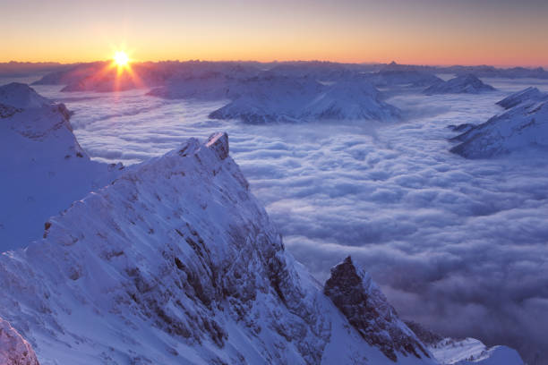 View from Garmisch-Partenkirchen (Bavaria) to the Alpspitze. The Alpspitze is 2628 meters (8622 ft) high and is located in the Zugspitze mountain range, Germany's highest mountain at 2962 meters (9717 ft).\nSee the small red dot in the middle of the mountain, that is a paraglider, next to it the cable car station.