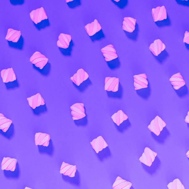 istock Pattern of marshmallow on purple background. 1083277394