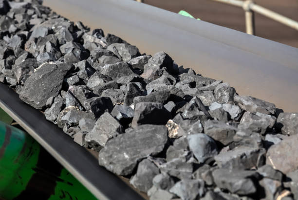 istock Manganese rock being moved on a conveyor belt 1083278034