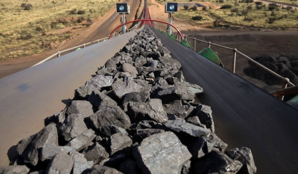 istock Manganese rock being moved on a conveyor belt 1083278132