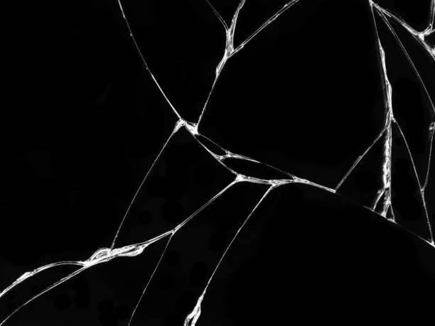 istock Cracked glass texture on black background 1083278254
