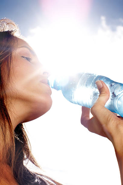 istock Thirsty woman drinking water on a sunny day 108327862