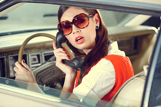 70s girl  in the old American car stock photo