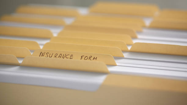 istock Yellow folders with labels and paper in a row 1083282246