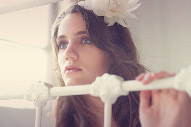 Tinted vintage dreaming young woman stock photo