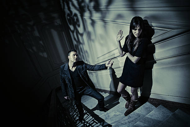 istock couple having an argument in a dark staircase 108328424