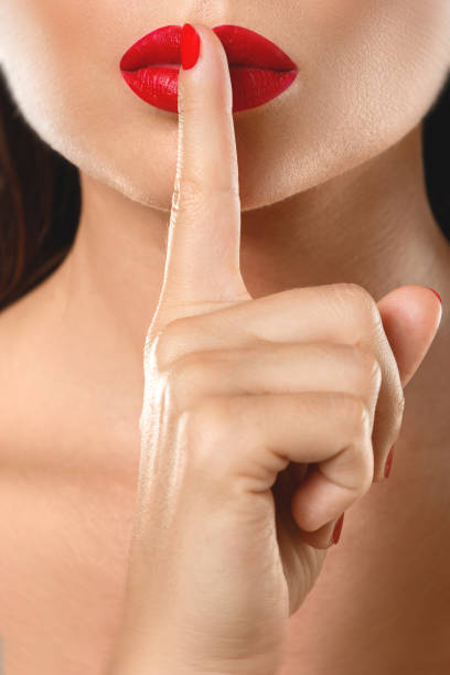 istock Woman is showing  shush or silence gesture 1083286154