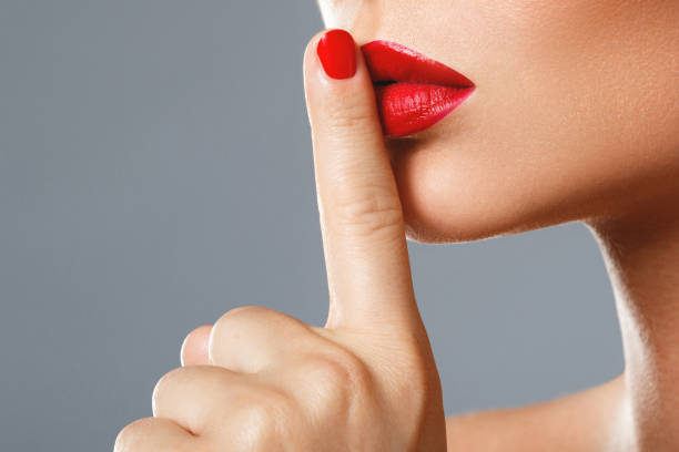 istock Woman is showing  shush or silence gesture 1083286156