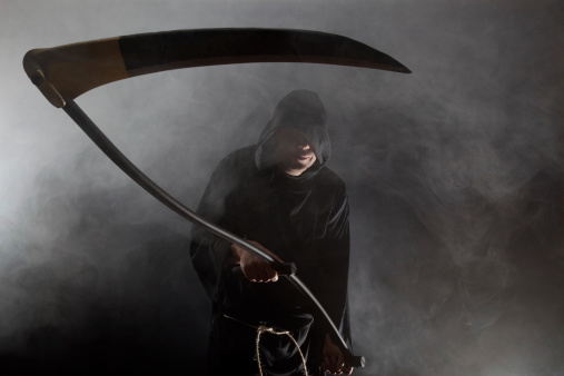 The Grim Reaper holding a scythe