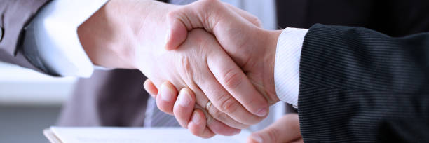 istock Man in suit shake hand as hello in office 1083286696