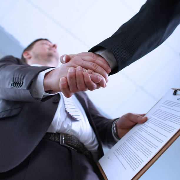 istock Man in suit shake hand as hello in office 1083286792