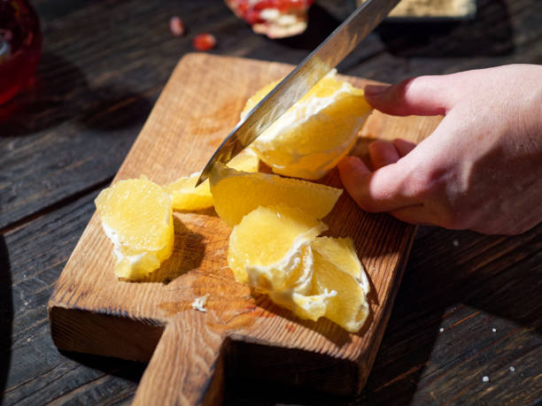 istock Making orange and pomegranate salad 1083286896