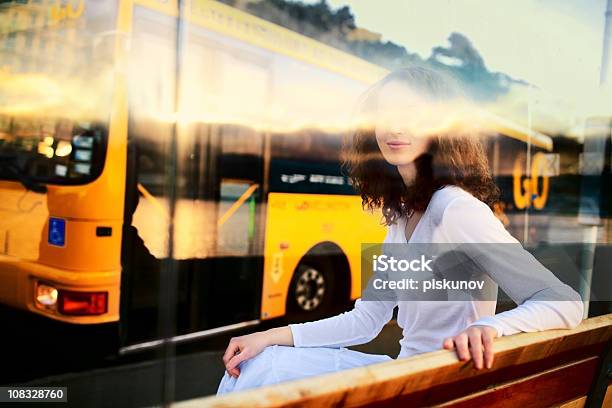 Bus Stop In Town Stock Photo - Download Image Now - Anticipation, Brown Hair, Bus Stop