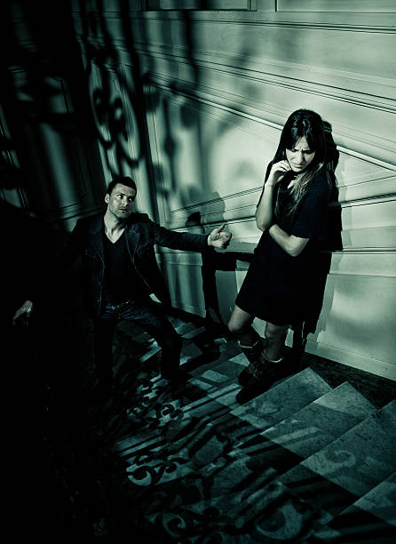 istock couple having an argument in a dark staircase 108328860