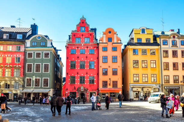 Stortorget square in Stockholm old town, Sweden Stockholm, Sweden - March 2018: People walking on Stortorget square in Stockholm old town stortorget stock pictures, royalty-free photos & images