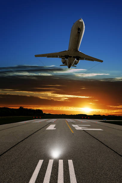 istock XL corporate jet airplane landing at sunset 108328918