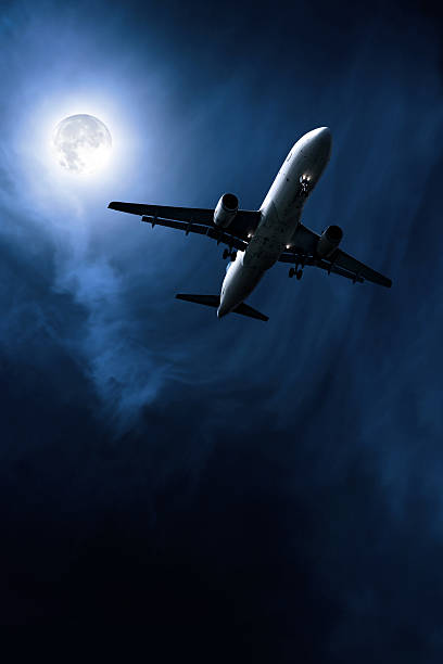 istock jet airplane taking off at night 108328919
