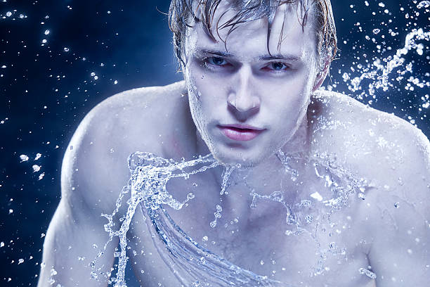 istock beautiful strong man in drops of water. 108328964