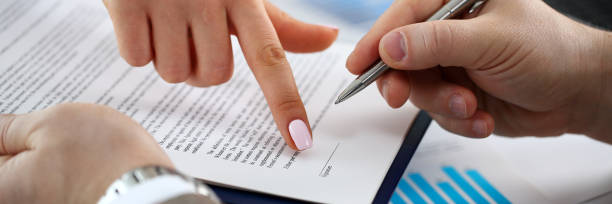 istock Female arm offer contract form on clipboard pad 1083290508