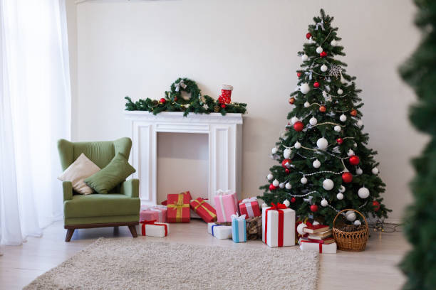 istock Christmas tree with presents and decorations the lights new year Garland 1083291020