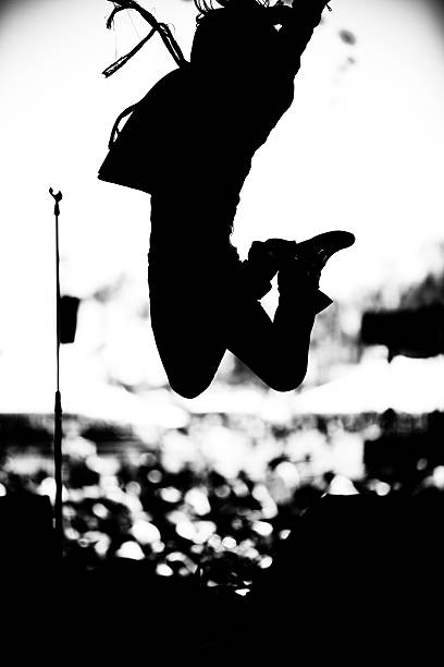 Rock musician leaping through the air  mosh pit stock pictures, royalty-free photos & images