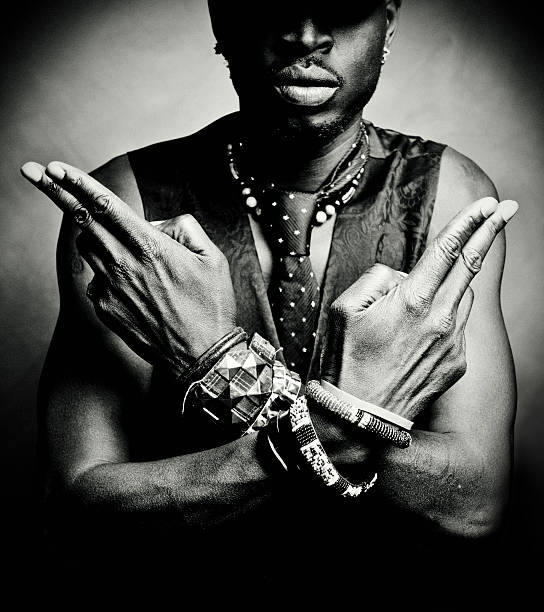 hands/guns young man showing "gun fingaz". reggae stock pictures, royalty-free photos & images