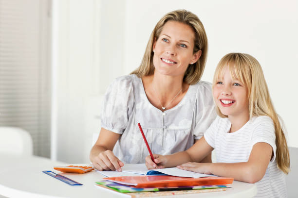 istock Mother Helping Daughter With Homework 108329337