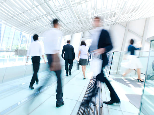 istock Blurred photo of business people in a rush at work 108329377