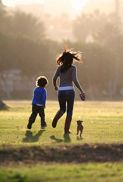 mother son and puppy stock photo