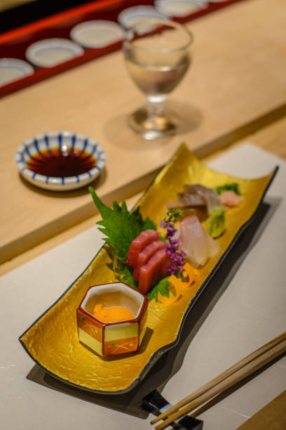 istock sashimi raw fish course with sake and tuna and sea urchin uni 1083298338
