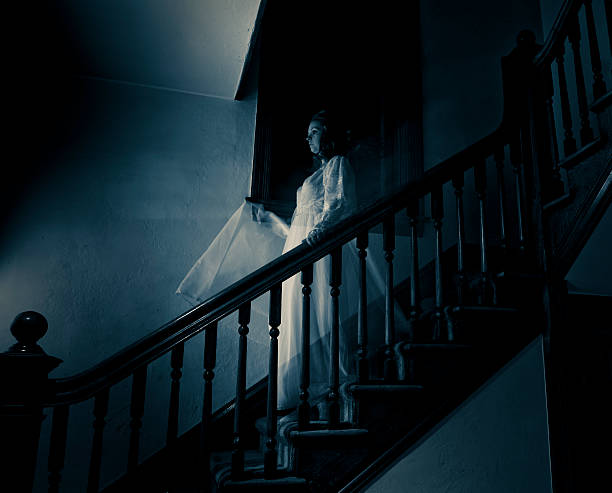 Ghost Woman on Haunted Staircase stock photo