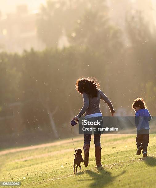 Happy Family Stock Photo - Download Image Now - Dog, Family, Public Park