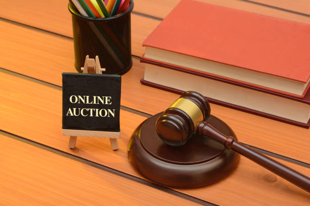istock Online auction with Wooden Gavel on table, law background 1083304548