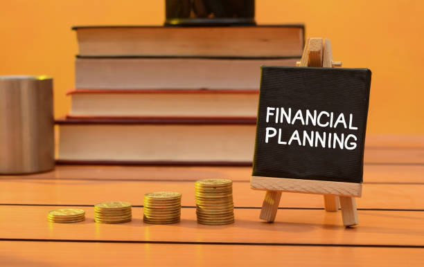 istock Financial planning concept with coins pile and books 1083304568