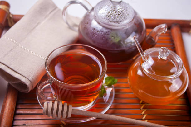 istock Cup of mint tea on a wooden background. 1083304698
