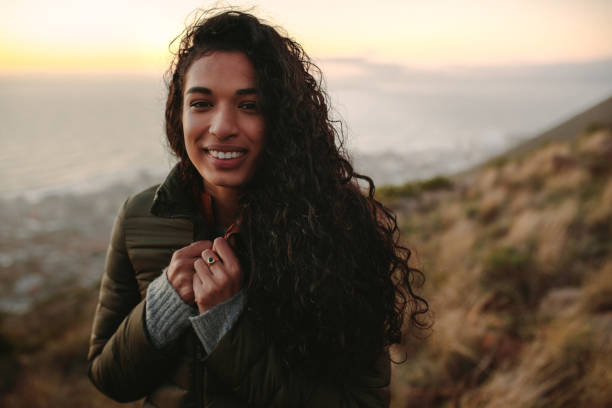 istock Woman in mountain peak on winter day 1083307716