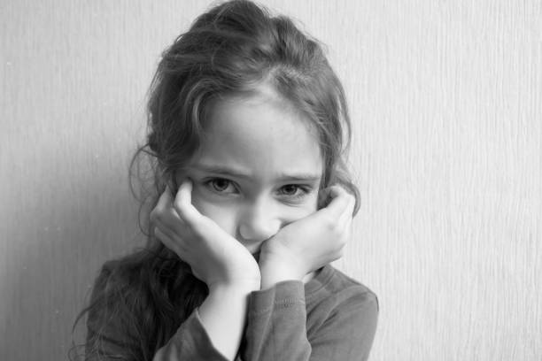 istock Little girl grimaces 1083307924