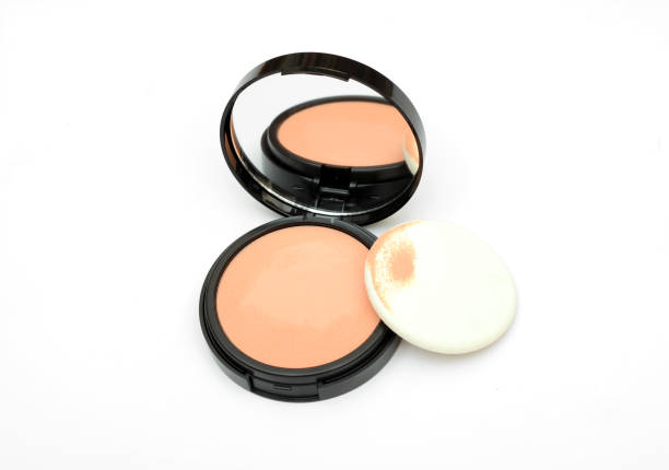 istock Face compact makeup powder with mirror on white background 1083309198